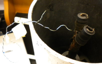 11. Attaching a labeled E1 thermocouple inside the cavity and E2 with the cylinder
